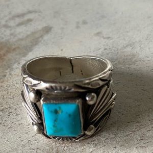 Silver and turquoise size nine women ring.  Has tribal stamp marked inside